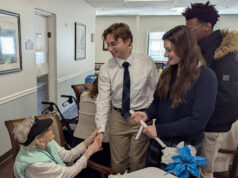 Holy Cross High School Students share holiday spirit at Brookdale Senior Living in Dover
