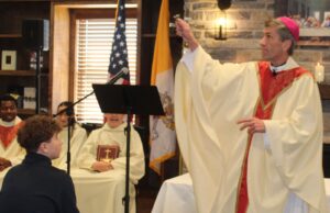 Bishop Koenig encourages Holy Cross High School students to listen when they are called: Photo gallery