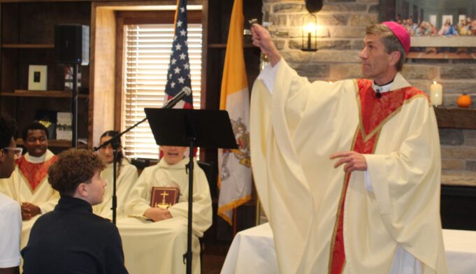 Bishop Koenig encourages Holy Cross High School students to listen when they are called: Photo gallery