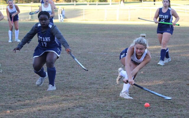A SS. Peter and Paul player backhands the ball toward the Tome goalie.