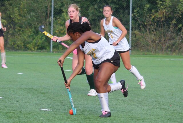 Kasey Nwokobia clears the ball for the Pandas. She also had a defensive save.