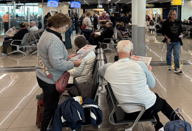 Pilgrims read The Dialog at the airport in Rome. Dialog photo/Bob Krebs