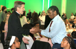 Bishop Koenig, De Sales University President Father James Greenfield encourage Trainor scholars to reach Catholic education dreams