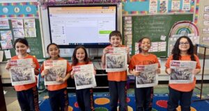 HAPPY CATHOLIC SCHOOLS WEEK: St. Anthony of Padua second-grade students celebrate with their photo on the cover of this week’s Dialog