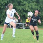 Molly Anderson of Ursuline and Friends' Lucia White race to a loose ball.