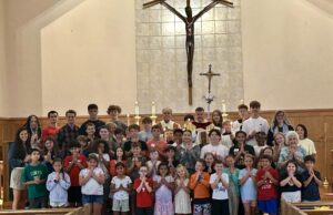 Youngsters get part of their religious education studies completed during camp at St. Matthew in Wilmington — Photo gallery