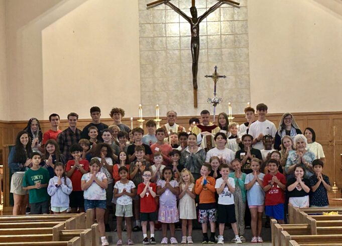 Youngsters get part of their religious education studies completed during camp at St. Matthew in Wilmington — Photo gallery
